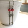 Arrow earrings, brass charms, red glass beads, tribal